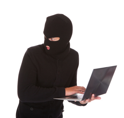 Burglar Using Laptop