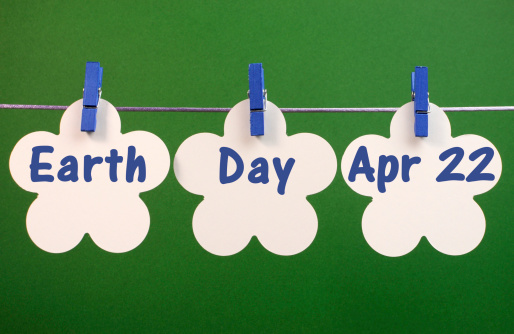 Earth Day message hanging from pegs on a line