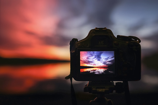 Camera capturing sunset. Photography view landscape. Camera the night view