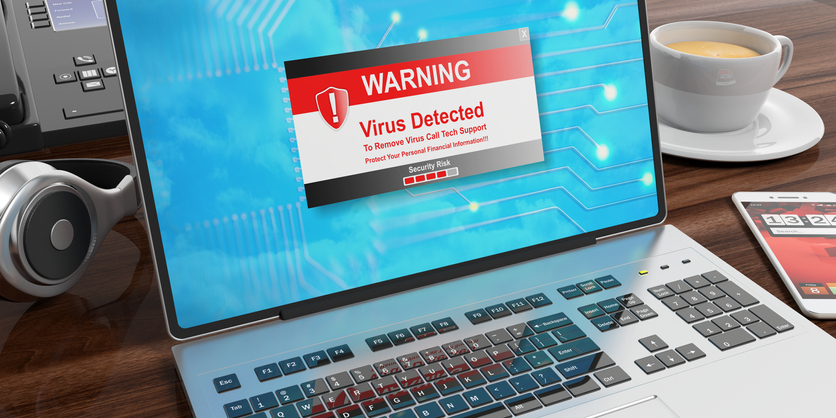 Virus alert on a laptop screen on an office desk. 3d illustration